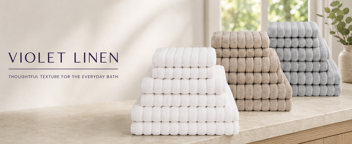 Violet Linen ribbed towels arranged in a calm, coordinated bathroom