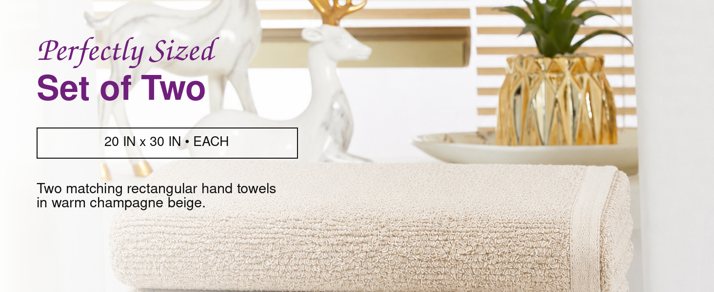 Squisita Champagne hand towel displayed for convenient hanging with integrated loop