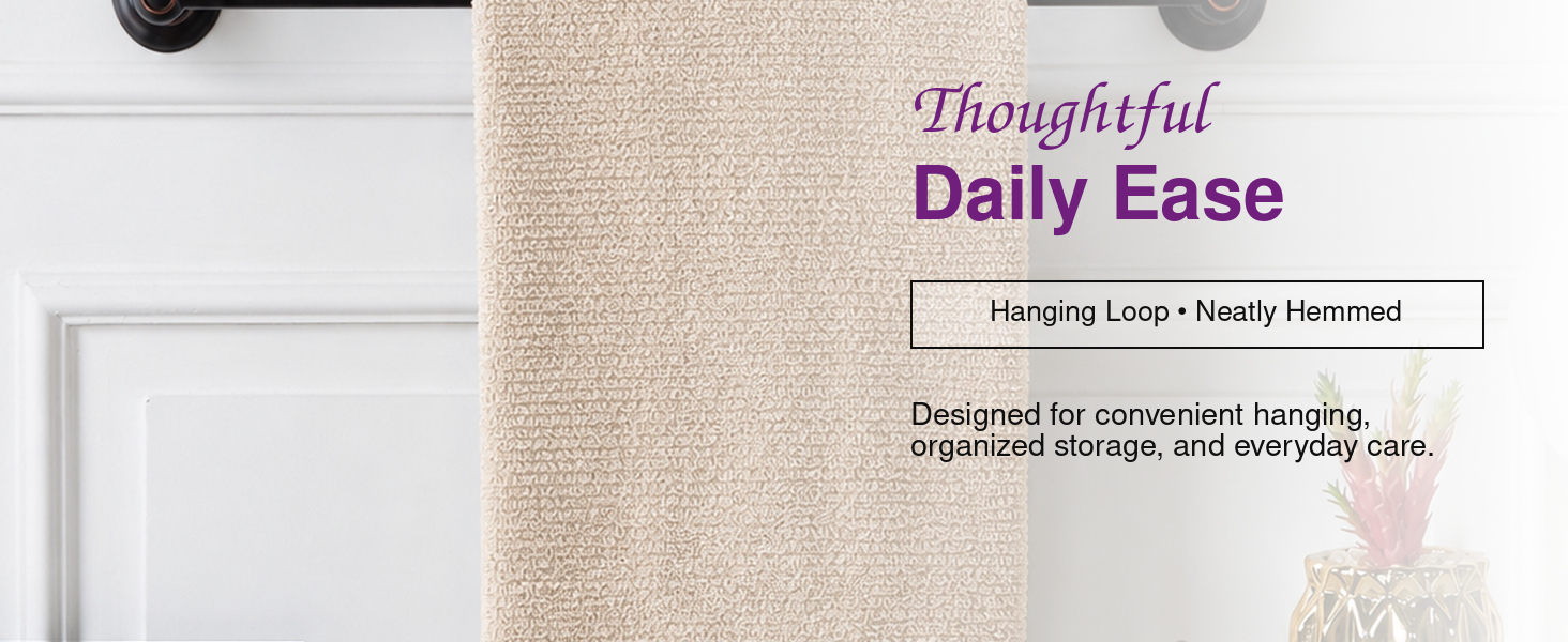 Coordinated Squisita Champagne hand towels in a bright modern bathroom and kitchen setting