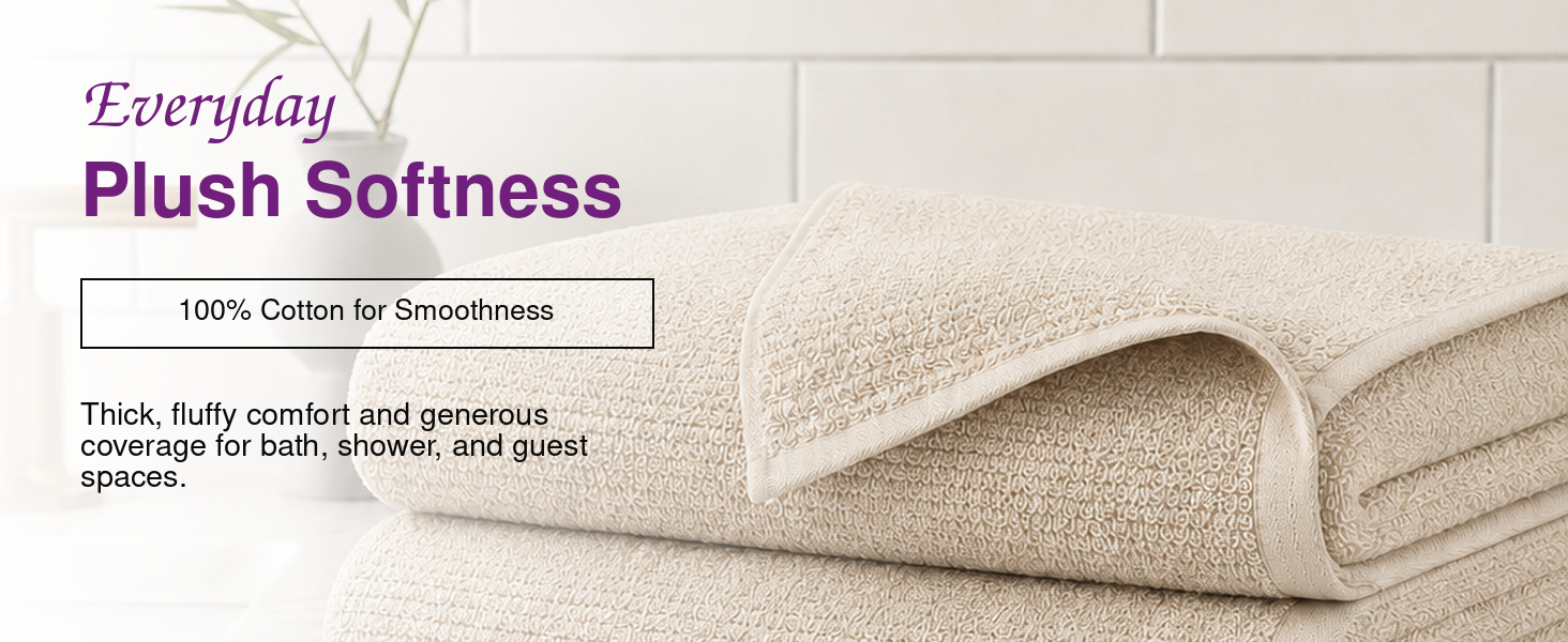 Stacked Squisita Champagne bath towels showing the substantial loft of the 650 GSM construction