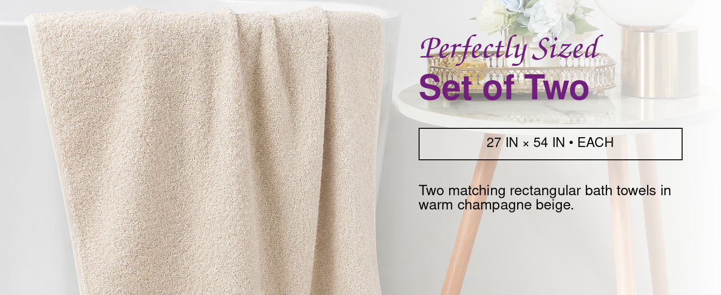 Coordinated Squisita Champagne bath towels in a bright modern bathroom with care information