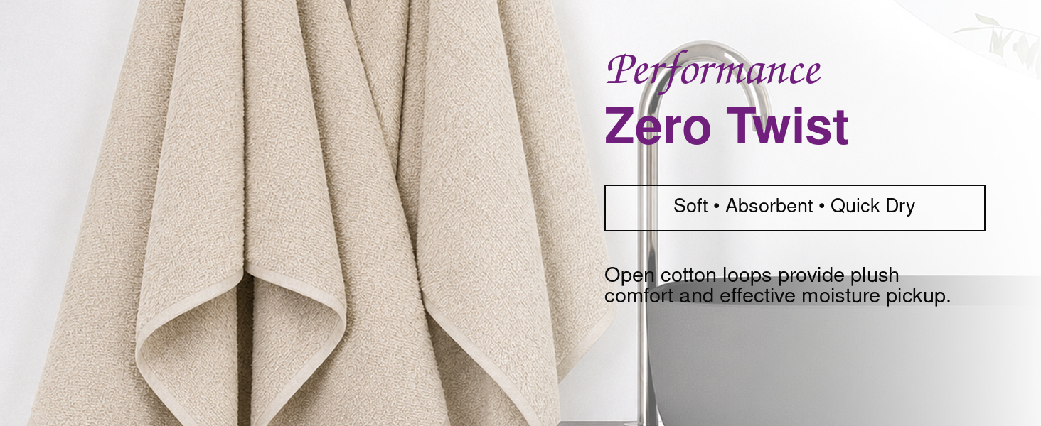 Two Champagne Beige Zero Twist bath sheets hanging beside a modern vanity
